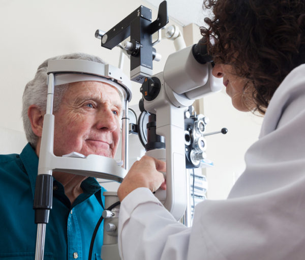 Senior man getting eye exam