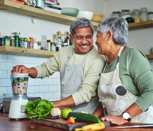 Shot of a senior couple preparing a healthy smoothie in the kitchen at home